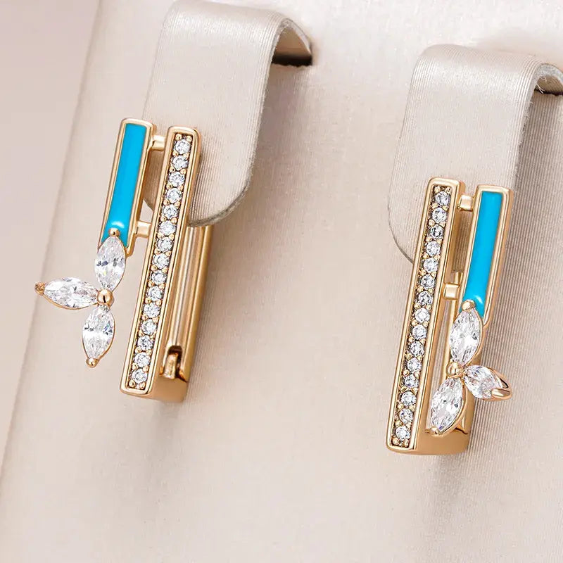 Elegante øreringe med blå emalje og zirkonia i guld