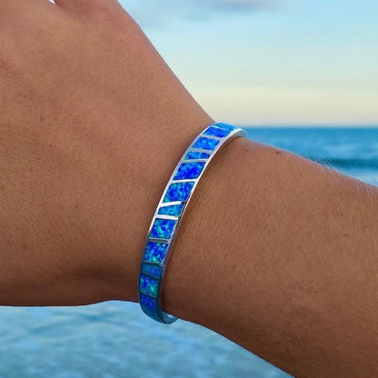 Blå og sølv opal armbånd