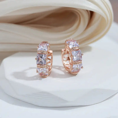 Elegante øreringe indlagt med gyldne krystaller