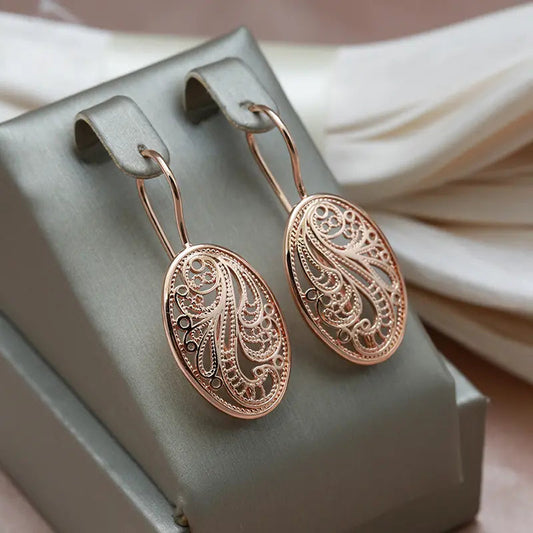 Elegante skinnende øreringe i guld
