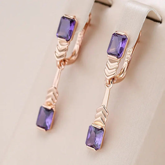 Elegante øreringe med krystaller i violet