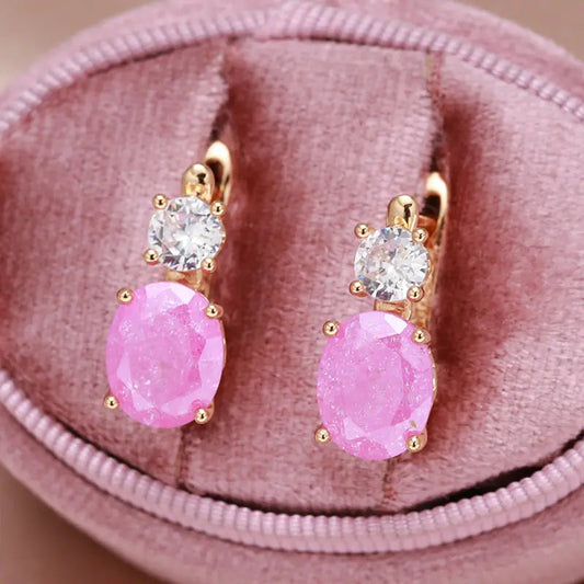 Elegante øreringe med pink zirconia i guld