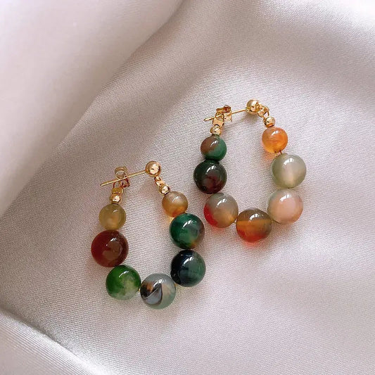 Elegante øreringe med multicolore sten