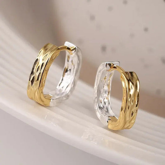 Elegante øreringe i guld og sølv