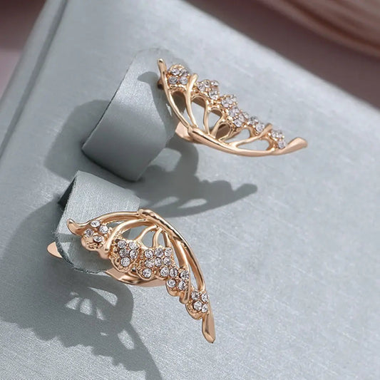 Elegante øreringe med skinnende vinger