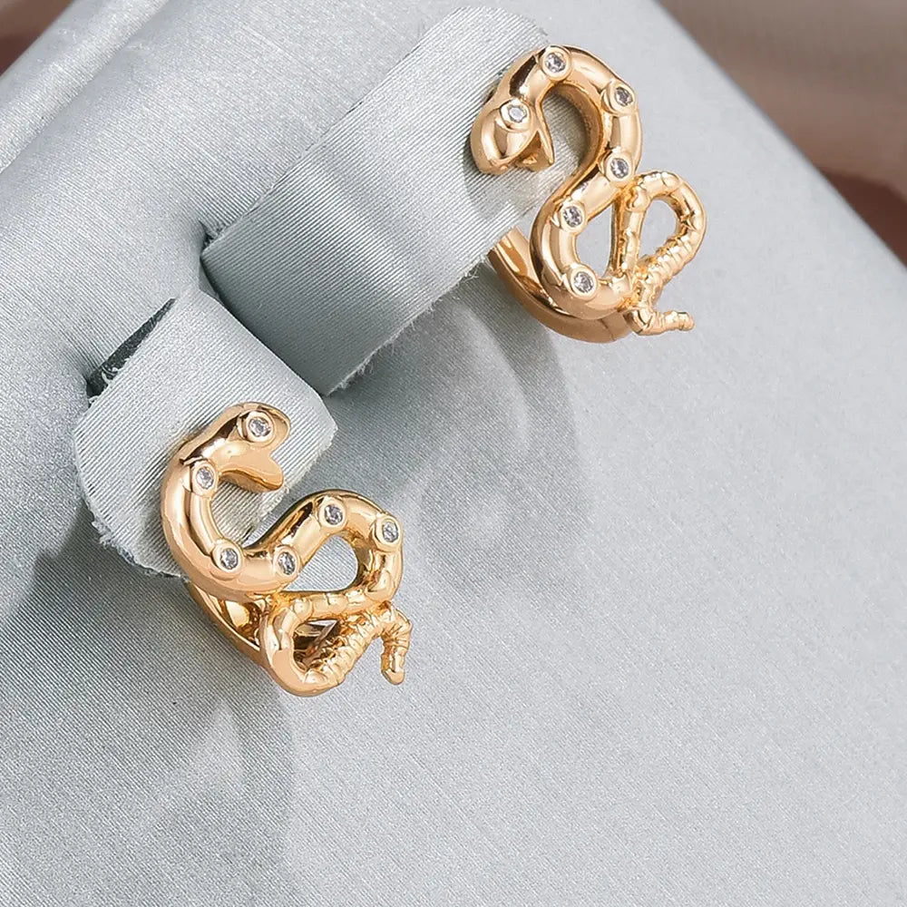 Elegant guld slange zirconia øreringe