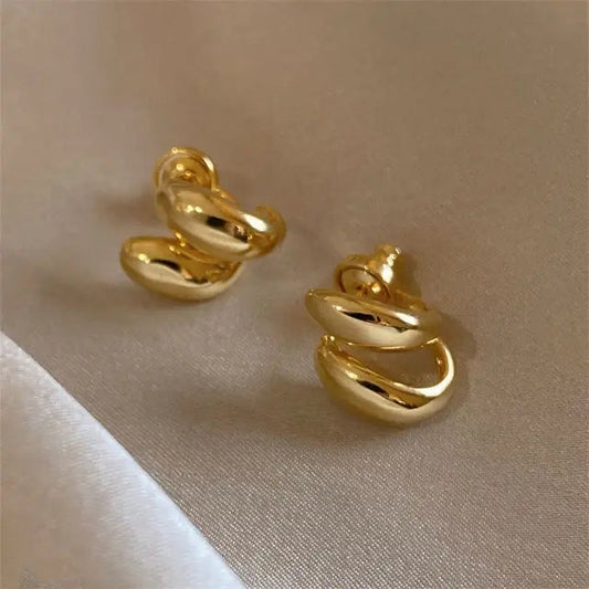Elegant guld spiral øreringe